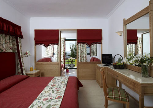 Номер отеля Mitsis Rinela Beach Resort & Spa 5* (Митсис Ринела Бич Резорт энд Спа 5*) Фото отеля Mitsis Rinela Beach Resort & Spa 5* (Митсис Ринела Бич Резорт энд Спа 5*)