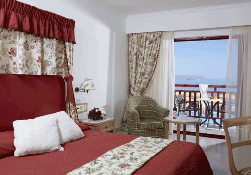 Номер отеля Mitsis Rinela Beach Resort & Spa 5* (Митсис Ринела Бич Резорт энд Спа 5*) Фото отеля Mitsis Rinela Beach Resort & Spa 5* (Митсис Ринела Бич Резорт энд Спа 5*)